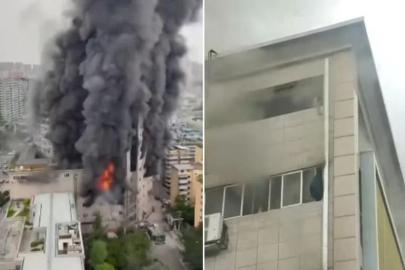 Çin'de alevlere teslim olan binanın çatısında mahsur kalanlar hastaneye kaldırıldı